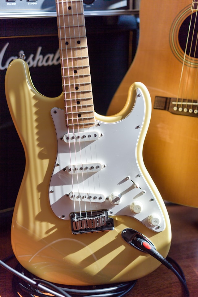 Stratocaster guitar near Marshall amp