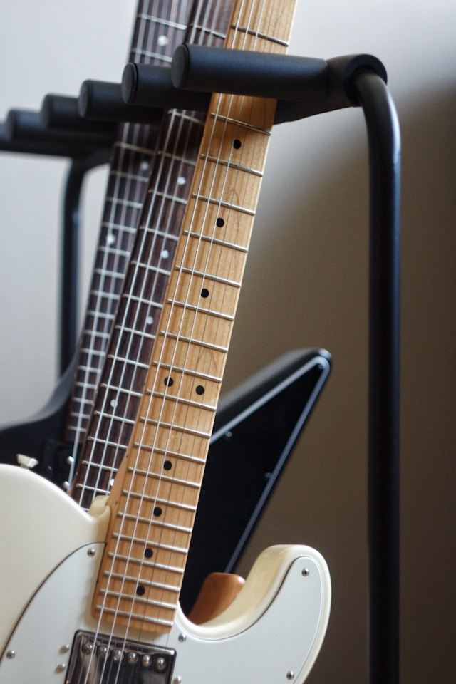 Guitars on stand with maple necks